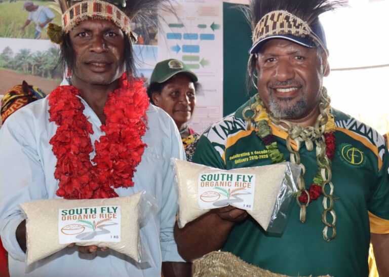 Sapuka Villagers Focus on Rice Farming Igu Kisua and OTDF CEO Havini Vira holding Sapuka Rice