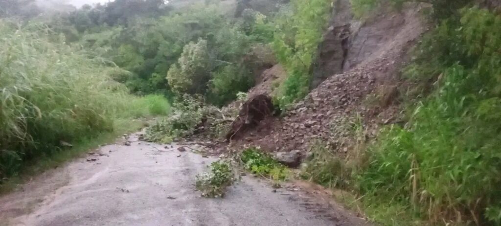 Pile of dirt and debris sitting on the road
