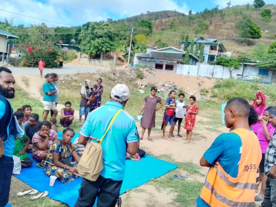 People gathered at a field for sexual health awareness program.