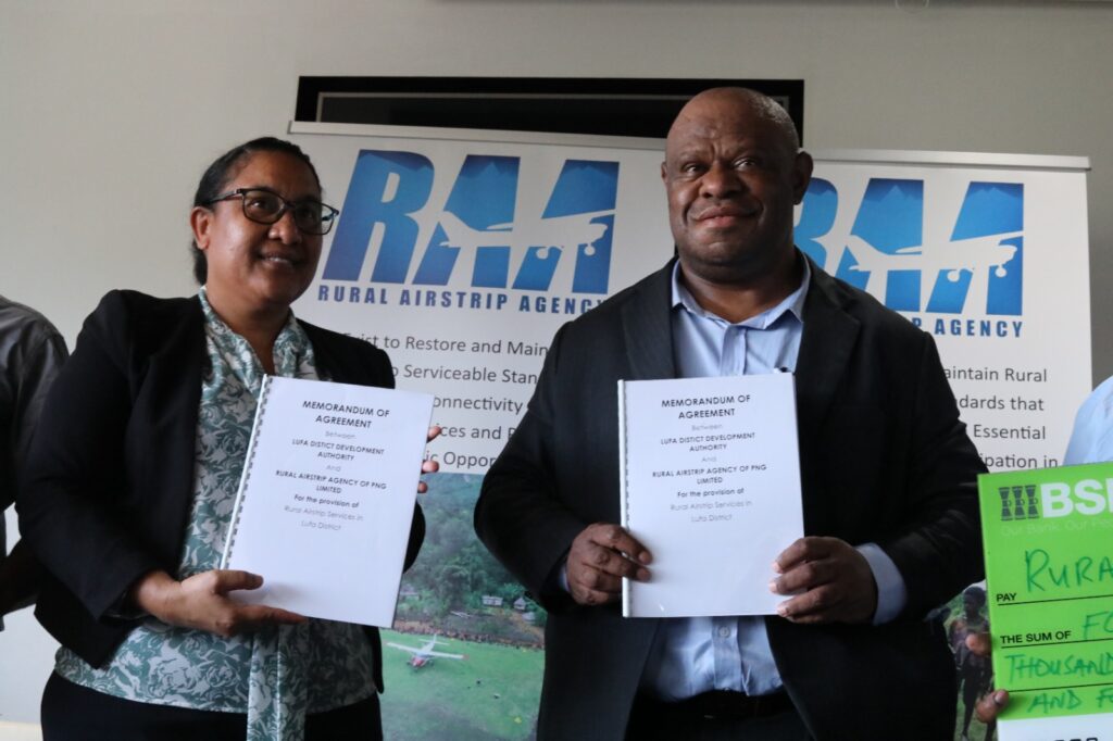 
Kim Opiti, CEO for RAA (left) and Lufa MP, Simon Kilepa (right) holding onto MOA copies. 