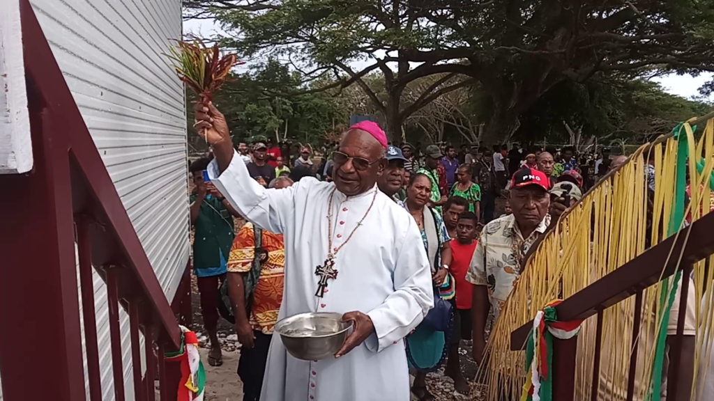 Priest blesses new classroom at St Patrick's Yule Island Primary School.