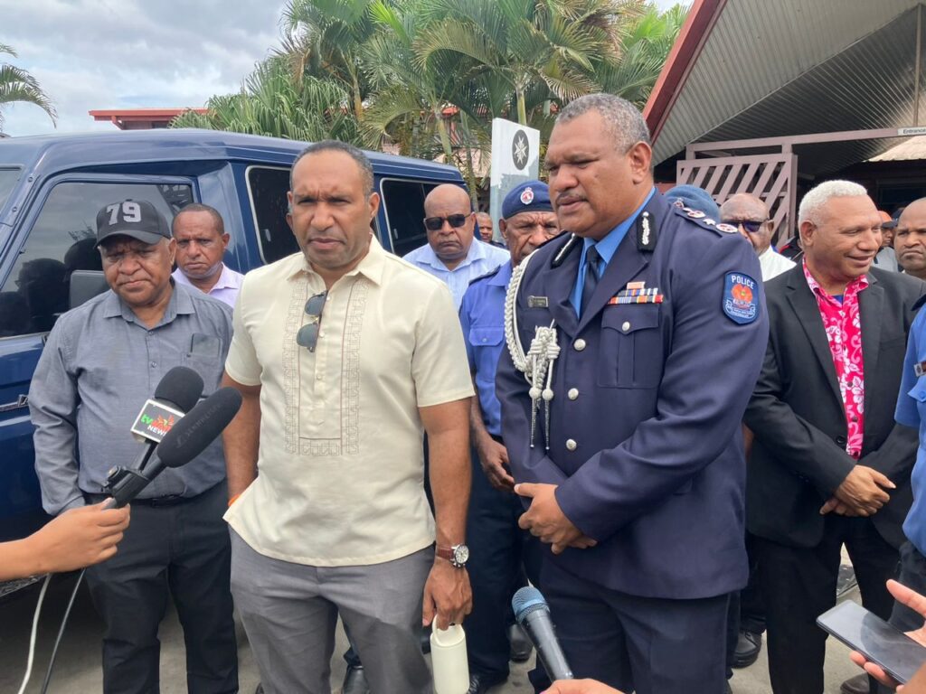 Acting CEO of the NCDPHA, Dr Robin Oge (left) and Commissioner of Police, David Manning (right), speaking to the media at St John's Hospital, Gerehu.