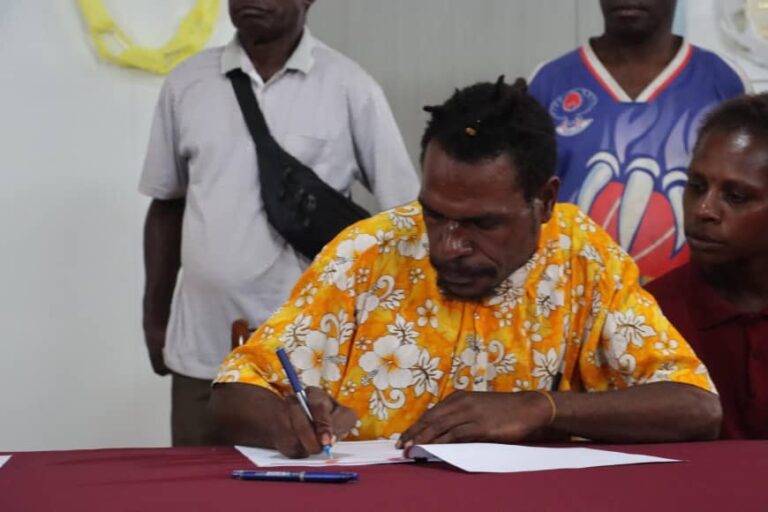 29 Australian Grants awarded to remote South Fly communities Man signing