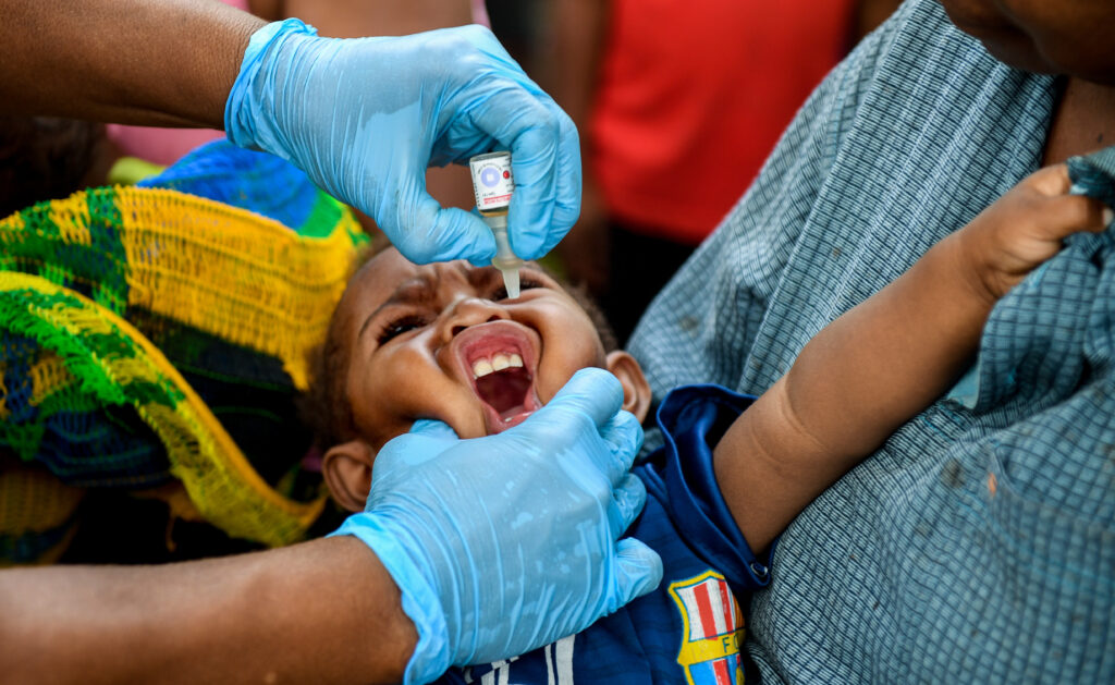 Australia funding vaccines after polio find in PNG A young child is seen at the Malahang Health Clinic where the Polio vaccine is administered to children in Lae, Marobe Province, Papua New Guinea, Tuesday, July 24, 2018. A confirmed Vaccine Derived Polio Virus (VDPV) in Lae, Morobe Province, Papua New Guinea was reported to WHO on 21 June, 2018. Four rounds of supplementary immunisation activity (SIA) targeting children less that five years of age is planned from July to October 2018, to combat the virus. (AAP Image for Gavi/Brendan Esposito)