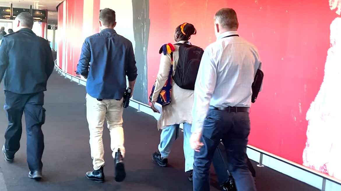 A supplied image obtained on Thursday, June 12, 2025, of federal police take for questioning a 56-year-old woman at Brisbane Airport on Wednesday over allegations that she exploited 15 PNG students. (AAP Image/Supplied by AFP)
