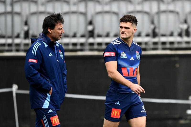 Nathan Cleary (right) speaks with coach Laurie Daley during a NSW Blues State of Origin Captian’s Run at Optus Stadium, in Perth, Tuesday, June 17, 2025. (AAP Image/Dan Himbrechts)