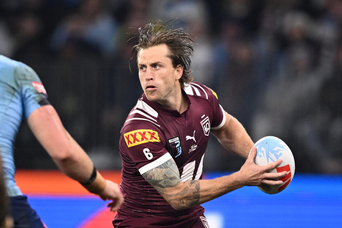 Cameron Munster of the Maroons looks to pass the ball during the State of Origin game two match between the Queensland Maroons and the NSW Blues at Optus Stadium in Perth, Wednesday, June 18, 2025. (AAP Image/Dan Himbrechts)