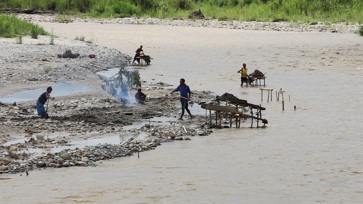 Alluvial Mining site - muddy river bank