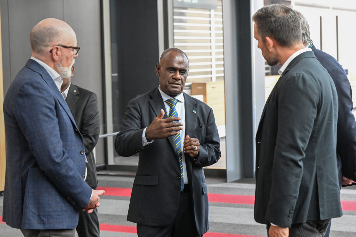 Solomon Islands Prime Minister Jeremiah Manele (centre) is seen talking to attendees during the 14th Australia-Solomon Islands Business Forum in Brisbane.