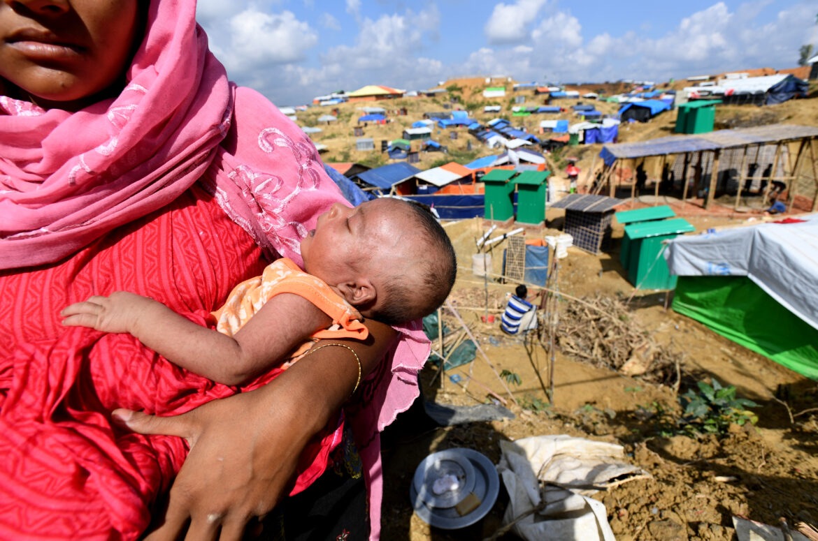 Australia urged to step up to help fill US aid void Rohingya refugee Janet Ara with her 27-day-old boy