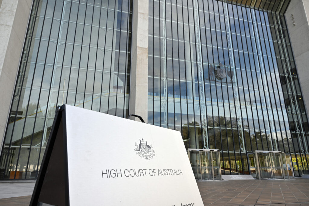 A sign in front of the Australian High Court Building.