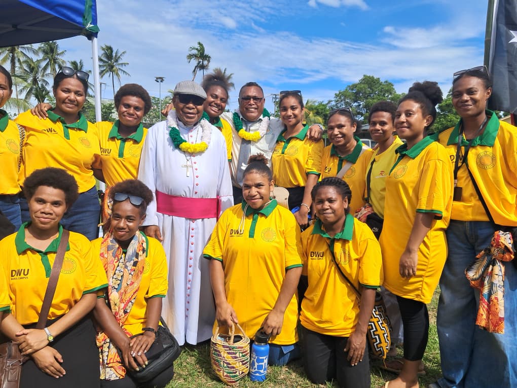 Final year student girls wearing yellow and green shirts